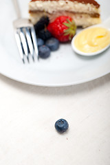 Image showing tiramisu dessert with berries and cream