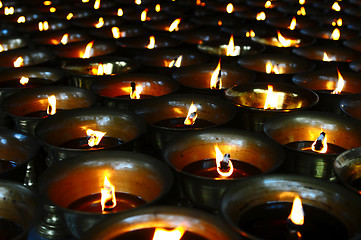 Image showing Burning oil lamps