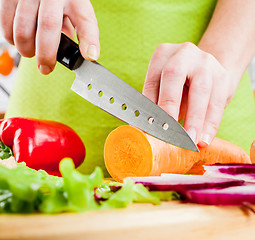 Image showing Woman's hands cutting vegetables