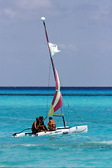 Image showing cloudy  catamaran  boat  and coastline in mexico playa del carme