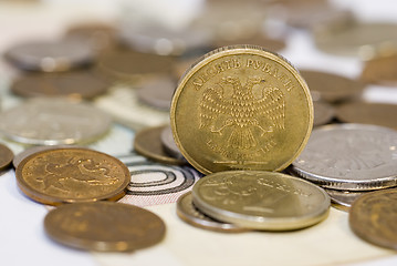 Image showing Some coins on the banknote 