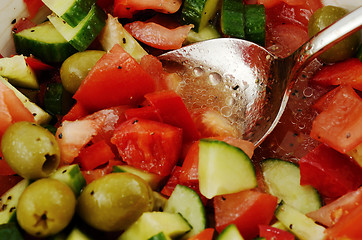 Image showing fresh summery salad of fresh olives and tomatos