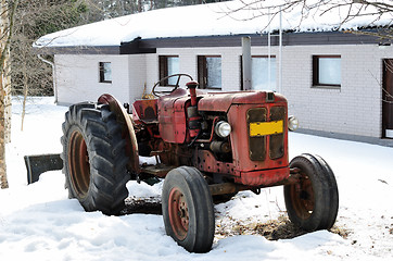 Image showing old red tractor on a farm 