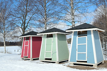 Image showing three beach hats in winter