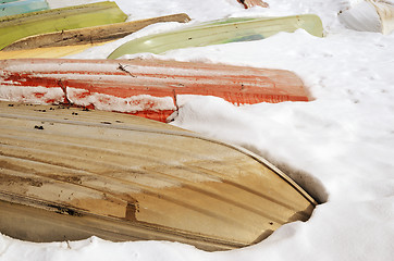 Image showing boats in winter under the snow 
