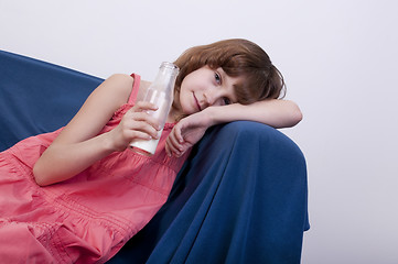 Image showing child drinking milk from a glass bottle