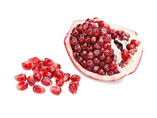 Image showing Part of pomegranate fruit isolated on white background. Closeup.
