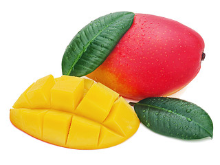 Image showing Fresh mango fruit with cut and green leaves isolated on white ba
