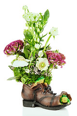 Image showing Flower bouquet arrangement centerpiece in old shoe with frogs is