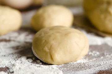 Image showing Dough on wooden board