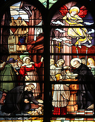 Image showing Saint Vincent de Paul raising a newborn and christening