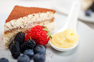 Image showing tiramisu dessert with berries and cream