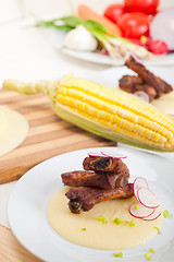 Image showing pork ribbs on polenta corn cream bed