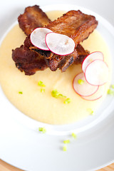 Image showing pork ribbs on polenta corn cream bed