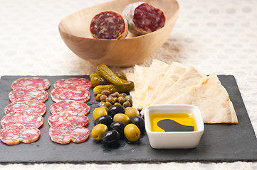 Image showing cold cut platter with pita bread and pickles