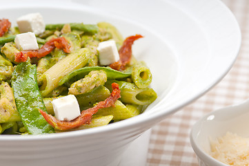 Image showing Italian penne pasta with sundried tomato and basil