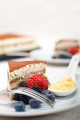 Image showing tiramisu dessert with berries and cream