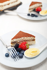 Image showing tiramisu dessert with berries and cream