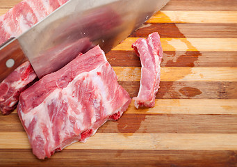 Image showing chopping fresh pork ribs 