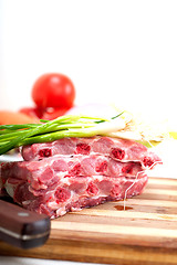 Image showing chopping fresh pork ribs and vegetables