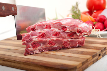 Image showing chopping fresh pork ribs and vegetables