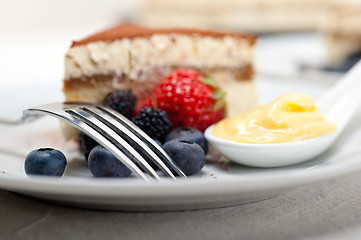 Image showing tiramisu dessert with berries and cream