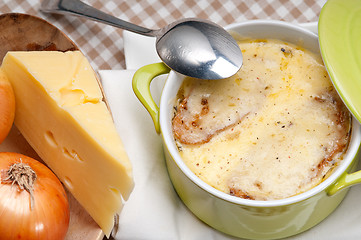 Image showing onion soup with melted cheese and bread on top