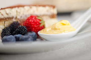 Image showing tiramisu dessert with berries and cream