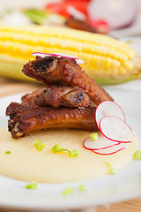 Image showing pork ribbs on polenta corn cream bed