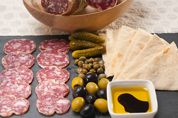 Image showing cold cut platter with pita bread and pickles