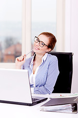 Image showing smiling successful young business woman 