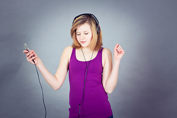 Image showing dancing happy teenager girl listening to music 