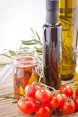 Image showing tatsty geen olives tomatoes and olive oil 