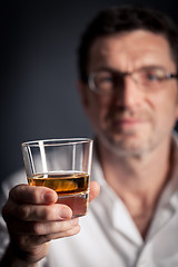 Image showing adult man holding an alcoholic drink