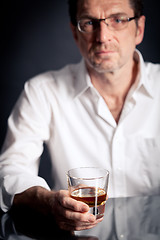 Image showing adult man holding an alcoholic drink