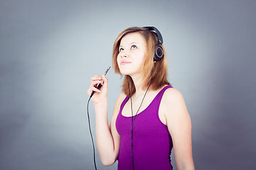 Image showing dancing happy teenager girl listening to music 