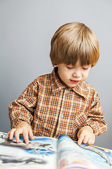 Image showing child reading a book