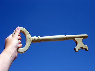 Image showing hand holding a key