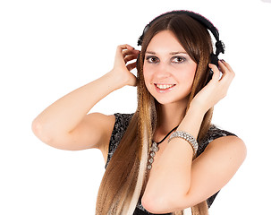 Image showing young blonde woman listening music