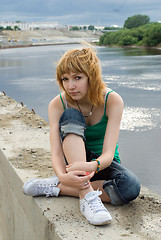 Image showing Pretty girl on river bank