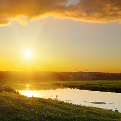 Image showing dramatic sunset over river 