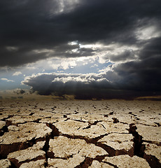 Image showing dramatic sky and drought earth