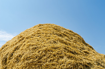 Image showing haystack of straw heap under cloudy sky