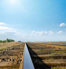 Image showing railway to horizon under sunny sky