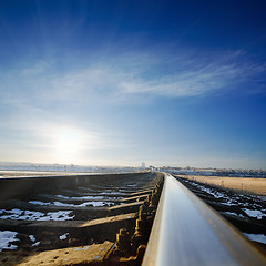 Image showing railroad to sunset. winter time