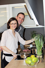 Image showing Young couple preparing dinner