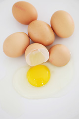 Image showing One cracked egg in a group