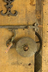 Image showing closeup retro wooden clock grunge mechanism gear 