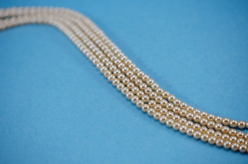 Image showing pearl necklace collar bead closeup blue background 