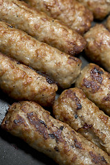 Image showing cooking sausages in a pan